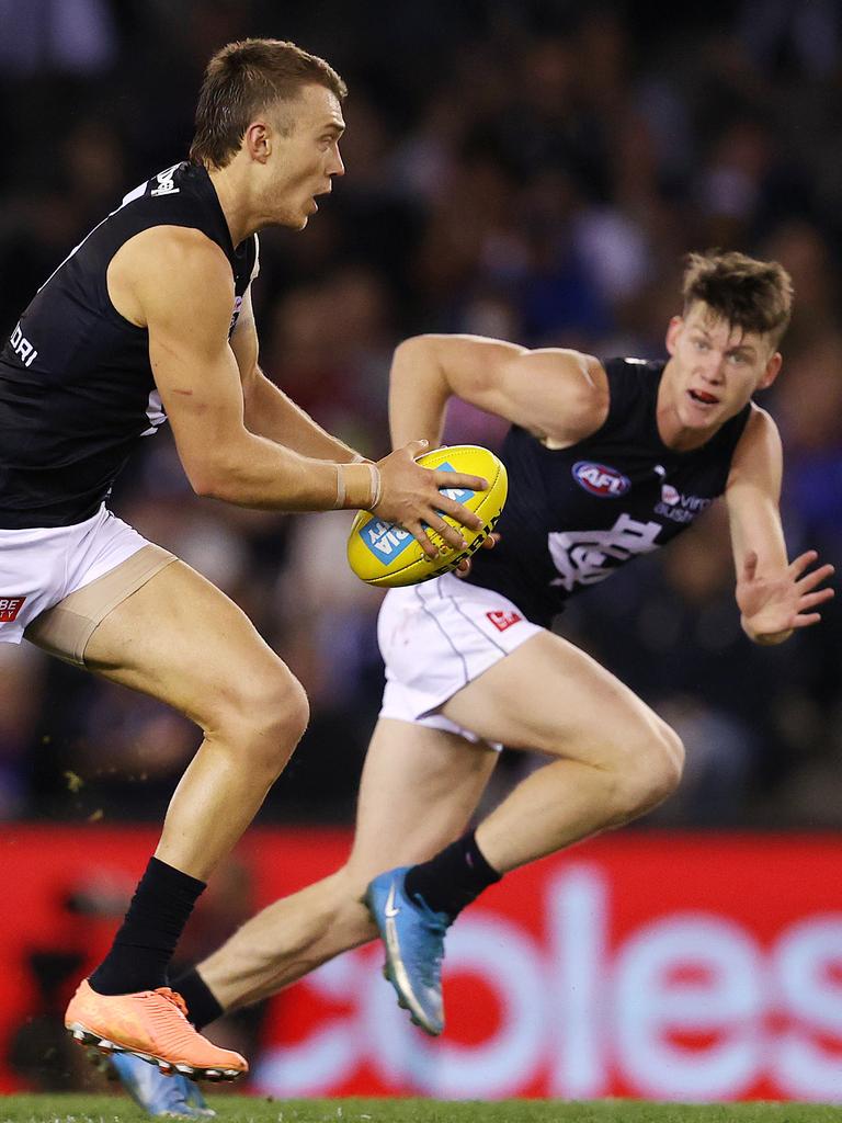 Patrick Cripps and Sam Walsh charge out of the centre square. Picture: Michael Klein