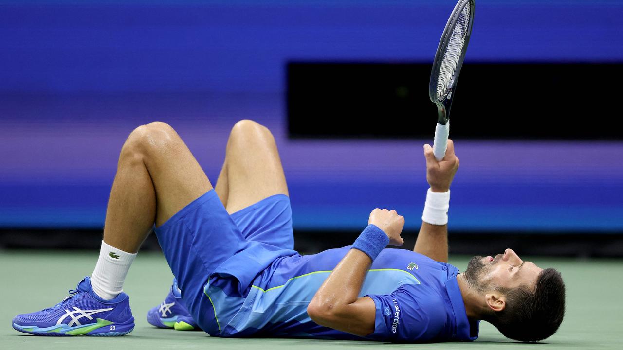 Novak Djokovic fell down and laid on the ground during the US Open final. Picture: Matthew Stockman / Getty Images via AFP