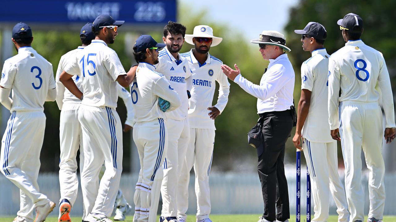 Umpire Shawn Craig speaks to players of India A before Day 4 of the Australia A game in Mackay. (Photo by Albert Perez/Getty Images)