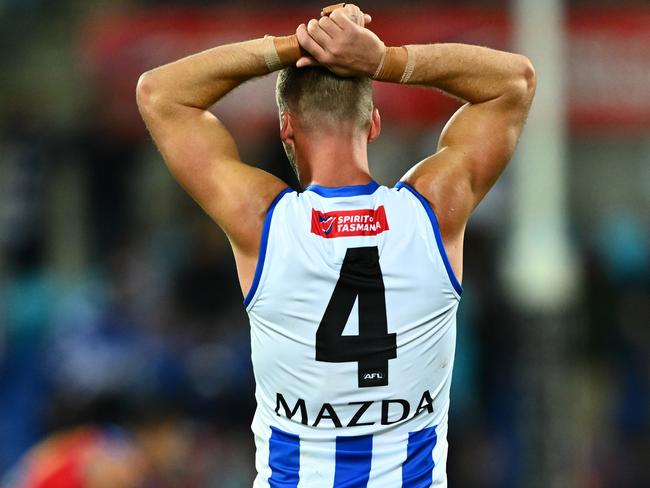 HOBART, AUSTRALIA - MAY 11: Aidan Corr of the Kangaroos reacts after game ends in a draw during the round nine AFL match between North Melbourne Kangaroos and Brisbane Lions at Ninja Stadium, on May 11, 2025, in Hobart, Australia. (Photo by Steve Bell/Getty Images)