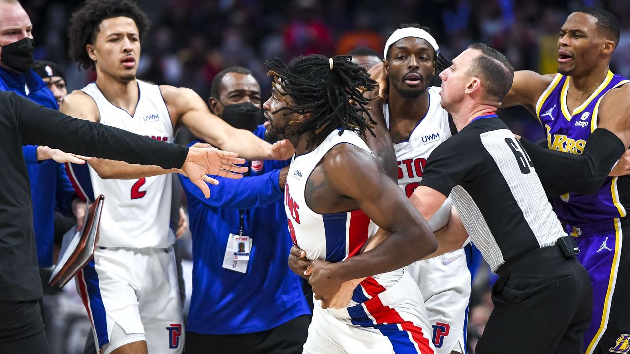 DETROIT, MICHIGAN - NOVEMBER 21: Isaiah Stewart #28 of the Detroit Pistons is restrained as he goes after LeBron James #6 of the Los Angeles Lakers during the third quarter of the game at Little Caesars Arena on November 21, 2021 in Detroit, Michigan. NOTE TO USER: User expressly acknowledges and agrees that, by downloading and or using this photograph, User is consenting to the terms and conditions of the Getty Images License Agreement. Nic Antaya/Getty Images/AFP == FOR NEWSPAPERS, INTERNET, TELCOS &amp; TELEVISION USE ONLY ==