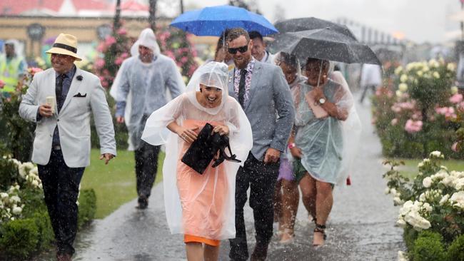 The 2018 Lexus Melbourne Cup at Flemington Racecourse. Flooding rain hits the track. Picture: Alex Coppel