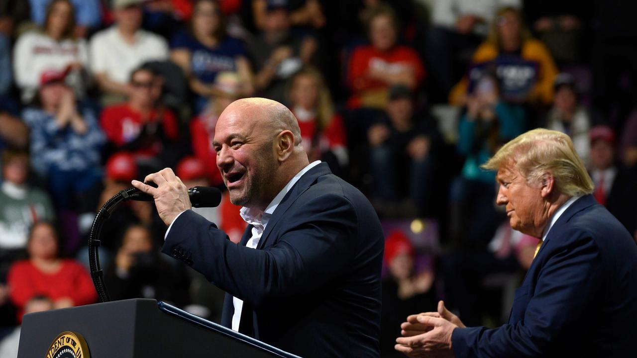 US President Donald Trump (R) claps as Ultimate Fighting Championship (UFC) President Dana White addresses a "Keep America Great" rally earlier this year