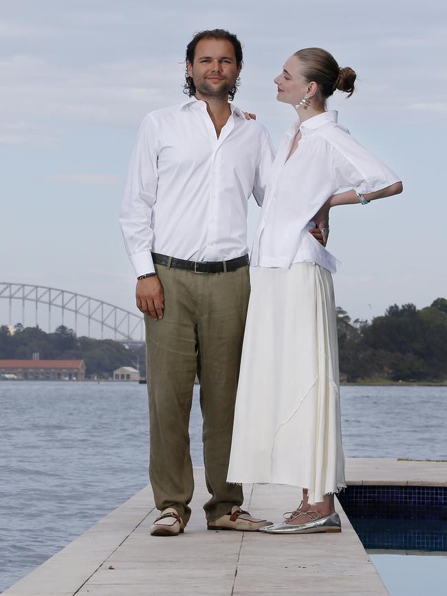 Developer David Avidan and his model and interior designer girlfriend Sophie Turnbull on the wharf of the apartment building in Point Piper where David has just purchased a derelict studio apartment for $720k at auction, that he will refurbish. Picture: John Appleyard