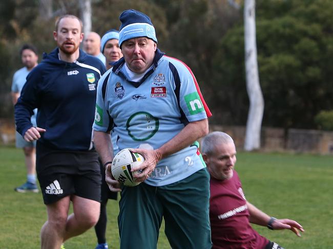 Anthony Albanese running with the footy in the Parlimentary NRL State of Origin touch football match at Parliament House in Canberra. Picture Kym Smith