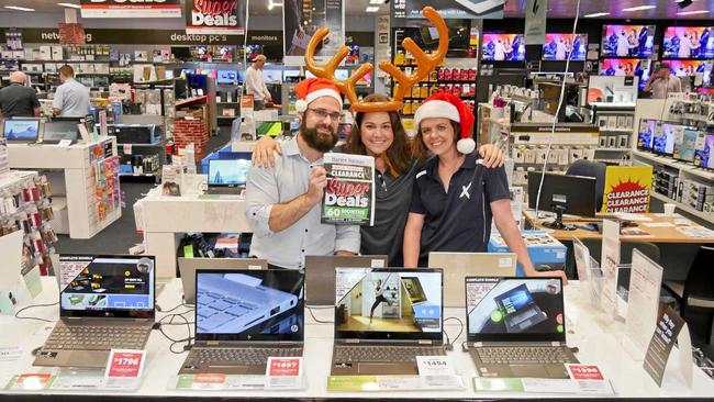 Harvey Norman Hervey Bay electronics proprietor James Blum with electronics specialist Sam Shorten and computers proprietor Aliza Luck getting ready for boxing day sales. Picture: Jessica Lamb