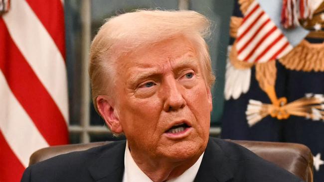 US President Donald Trump speaks to journalists about TikTok as he signs executive orders in the Oval Office of the White House in Washington, DC, on January 20, 2025. (Photo by Jim WATSON / POOL / AFP)