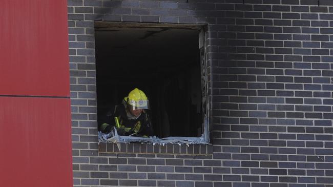 A firefighters surveys the damage after the fire.