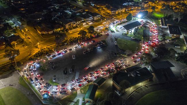 A long queue of cars lines up at the Merrylands drive through Covid-19 testing site. More people are reportedly avoiding Guildford and going to Merrylands. Picture: Damian Shaw