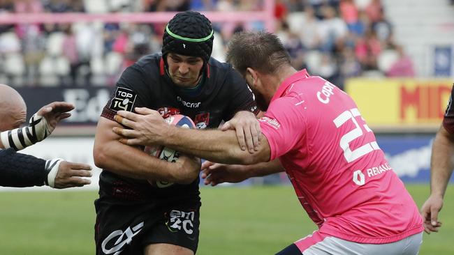 Lyon’s Australian flanker Liam Gill is tackled by Stade Francais's Italian prop Lorenzo Cittadini. Picture: AFP