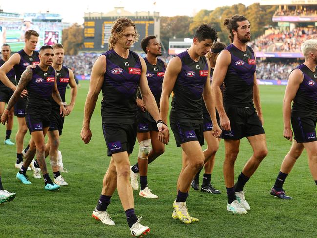 Fremantle players walk off after a controversial loss to Carlton. Picture: Sarah Reed/AFL Photos via Getty Images.