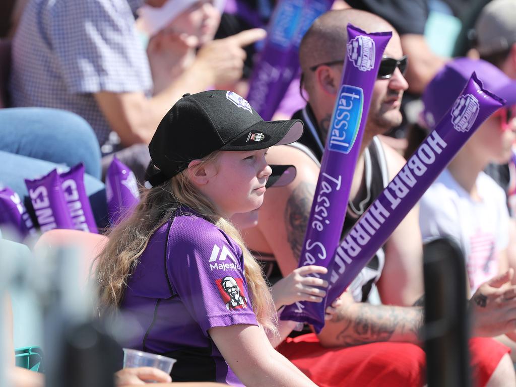 Fans enjoying the hot weather at the Big Bash match between the Hurricanes and Melbourne Stars at Blundstone Arena on Christmas Eve. Picture: LUKE BOWDEN