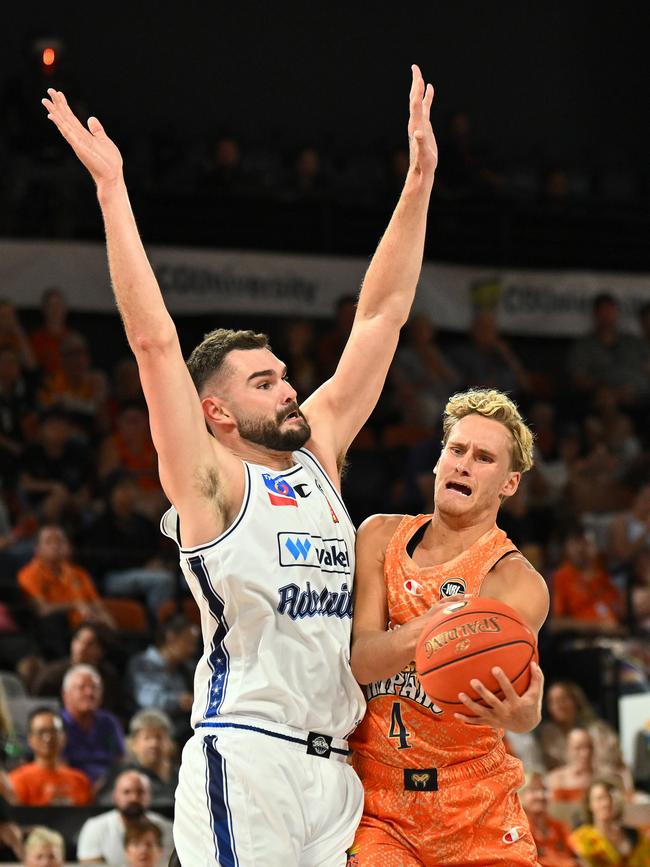 CAIRNS, AUSTRALIA - SEPTEMBER 28: Kyle Adnam of the Taipans is fouled during the round two NBL match between Cairns Taipans and Adelaide 36ers at Cairns Convention Centre, on September 28, 2024, in Cairns, Australia. (Photo by Emily Barker/Getty Images)