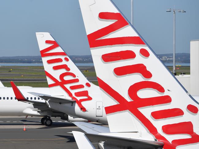 A general view of Virgin Australia aircraft parked at Sydney Domestic Airport, in Sydney, Tuesday, April 21, 2020. Virgin confirmed it had gone into administration on Tuesday, threatening up to 10,000 airline jobs after a board meeting of its international shareholders voted on Monday against providing additional financial support. (AAP Image/Dan Himbrechts) NO ARCHIVINGA general view of Virgin Australia aircraft at Sydney Domestic Airport, in Sydney, Tuesday, April 21, 2020. Virgin confirmed it had gone into administration on Tuesday, threatening up to 10,000 airline jobs after a board meeting of its international shareholders voted on Monday against providing additional financial support. (AAP Image/Dan Himbrechts) NO ARCHIVING