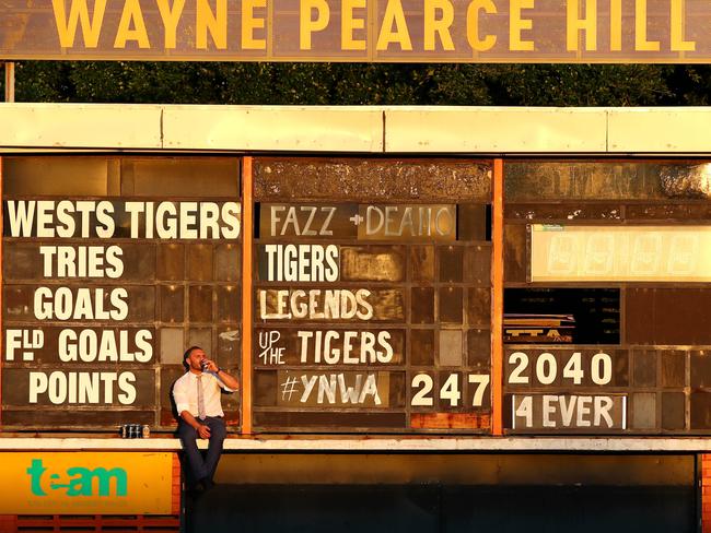 Robbie Farah sits up on the scoreboard drinking beers farewelling his beloved home ground, Leichhardt Oval after he was forced from the Wests Tigers club. Picture: Gregg Porteous