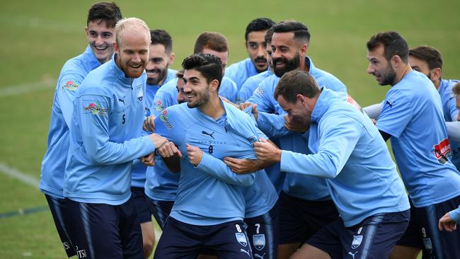 Paulo Retre is the centre of attention at a Sydney FC training session yesterday. Picture: AAP