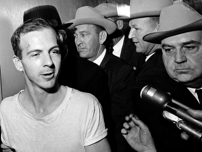 In this November 23, 1963 photo, surrounded by detectives, Lee Harvey Oswald talks to the media as he is led down a corridor of the Dallas police station for another round of questioning in connection with the assassination of John F. Kennedy. Picture: AP Photo