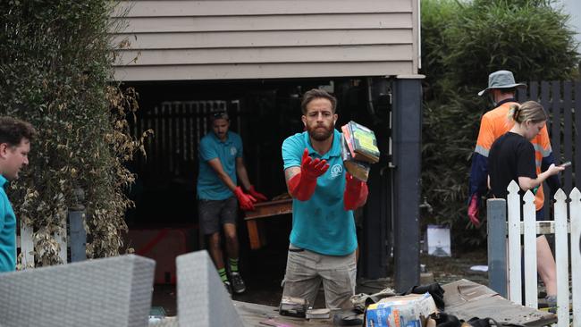 Cleaning up in Vincent St, Auchenflower. Picture: Annette Dew