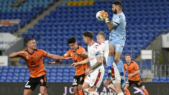 Paul Izzo of Adelaide United competes for the ball during the round 29 A-League match between the Brisbane Roar and Adelaide United at Cbus Super Stadium on July 19, 2020 on the Gold Coast, Australia. (Photo by Albert Perez/Getty Images)