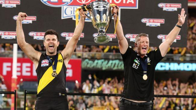 Trent Cotchin and Damien Hardwick lift the premiership cup.