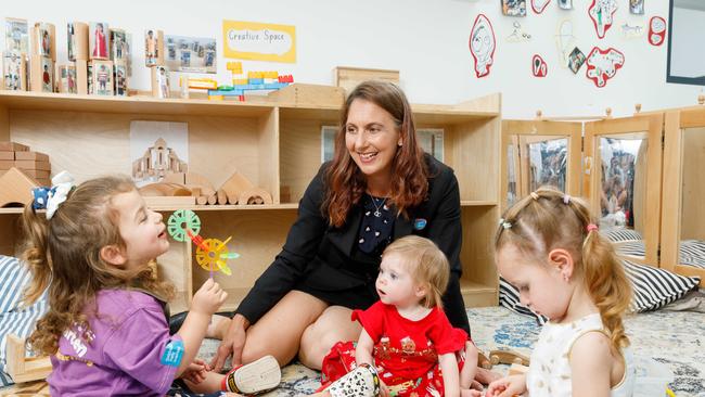 (File image) Lisa Emme, centre director of Goodstart Elara, plays with pupils Isla, Joy and Isabelle. Goodstart Early Learning has backed in the government’s decision to create the hub. Picture: Max Mason-Hubers