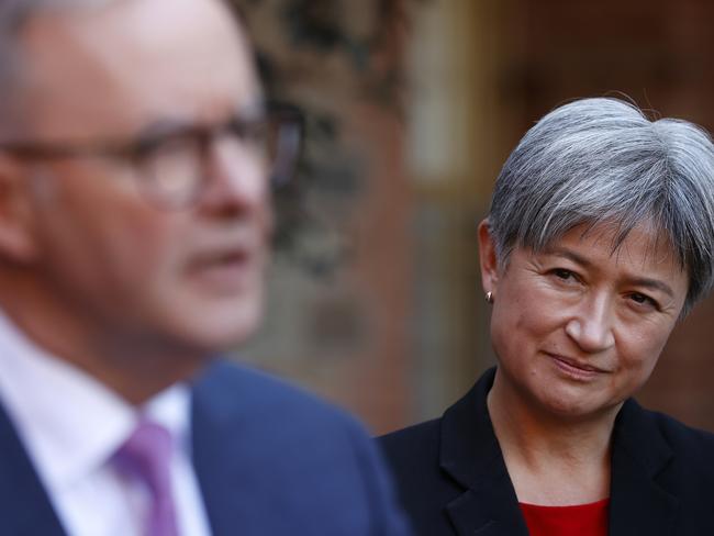 ADELAIDE, AUSTRALIA - MAY 20: Penny Wong listens to Labor Leader Anthony Albanese speak at a press conference during a visit to Cabra Dominican College on May 20, 2022 in Adelaide, Australia. The Australian federal election will be held on Saturday 21 May, 2022. (Photo by Lisa Maree Williams/Getty Images)