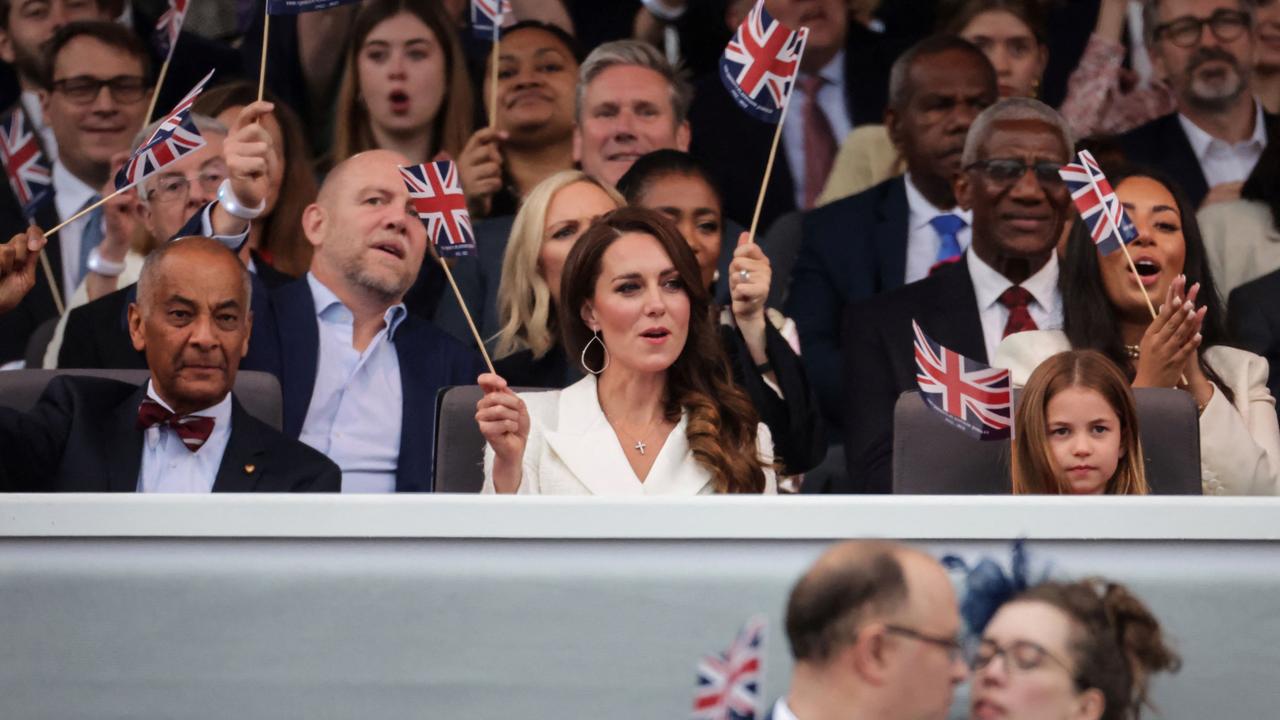 Britain's Catherine, Duchess of Cambridge waves a British national flag during the Platinum Party at Buckingham Palace. Picture: AFP