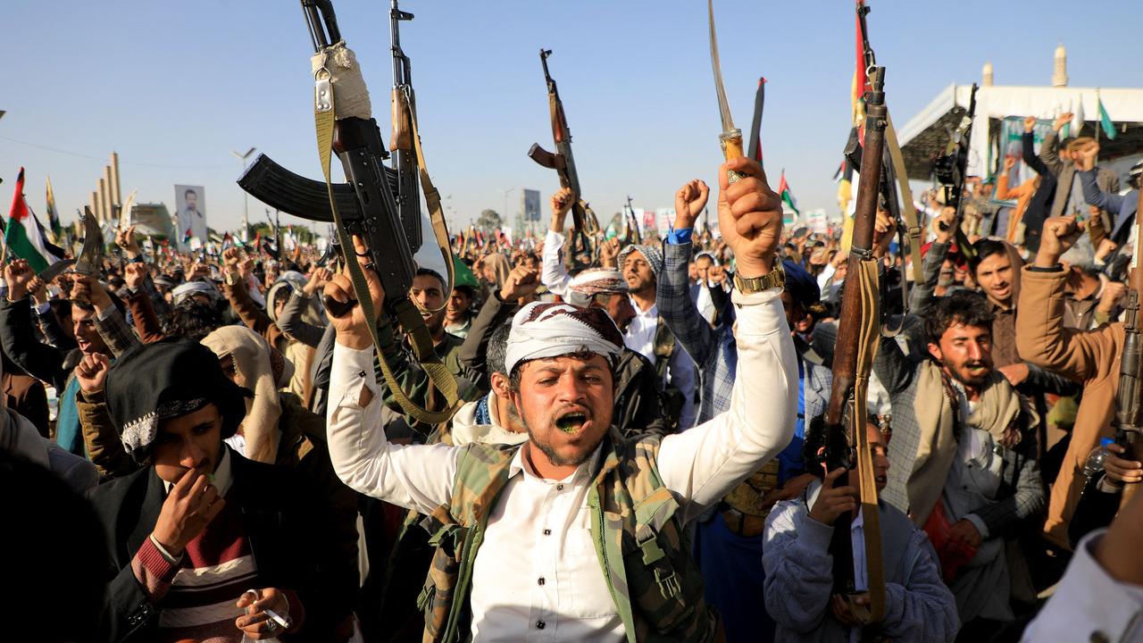 Houthi fighters take to the streets after strikes by the US and the UK. Picture: AFP