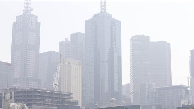 Smoke hangs over Melbourne CBD from bushfires in the north. Picture: David Caird.