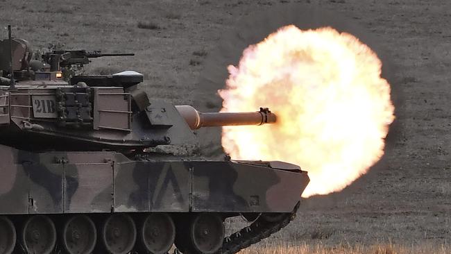 An Australian army M1A1 Abrams main battle tank fires a round at a target during military exercises at the Puckapunyal Military Base. Picture: AFP.