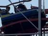 Woman hit by roller coaster ‘getting phone’