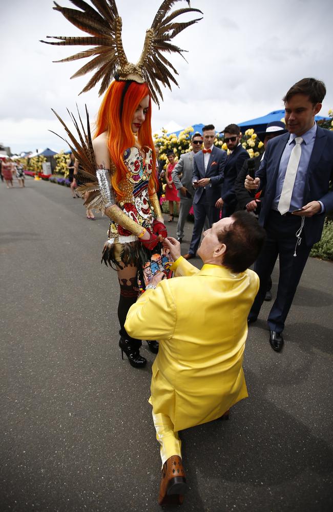 Geoffrey Edelsten proposes to Gabi Grecko on Cup Day. Picture: Bradley Hunter