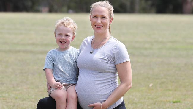 Exercise physiologist Kassia Beetham, who is 36 weeks pregnant, with her son Rex Beetham, three. Picture: Annette Dew