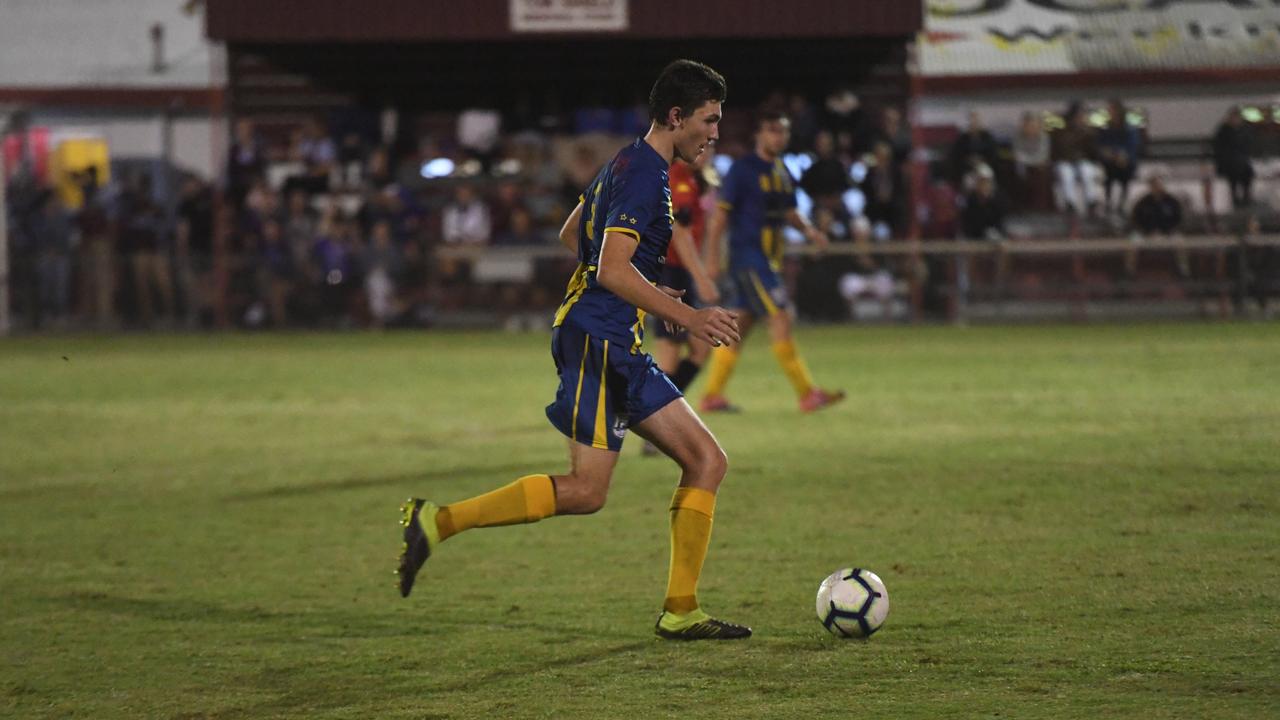 The Waves' Dylan Leggett runs with the ball during the Triple M Division 1 Cup final.