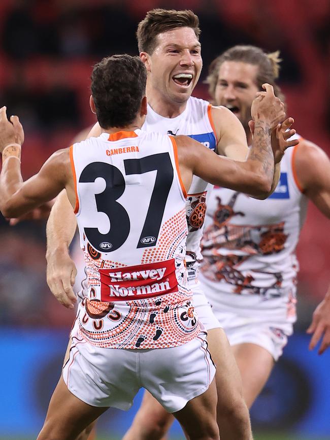 Greene is congratulated by teammates after kicking his torpedo. Picture: Getty Images