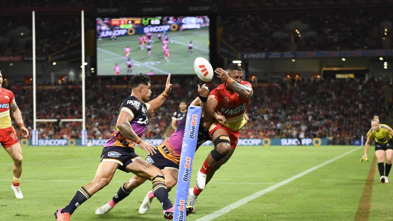 Reece Walsh comes up with a try-saving tackle on Tesi Niu. Picture: NRL Images.