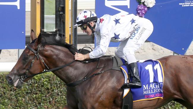 Jockey Luke Currie rides Sunlight to victory in the Magic Millions Two-Years-Old Classic. Picture: Jono Searle, AAP Image.