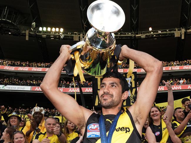 Marlion Pickett of the Tigers celebrates the win with the Premiership Cup during the 2019 AFL Grand Final between the Richmond Tigers and the GWS Giants at the MCG in Melbourne, Saturday, September 28, 2019. (AAP Image/Michael Dodge) NO ARCHIVING