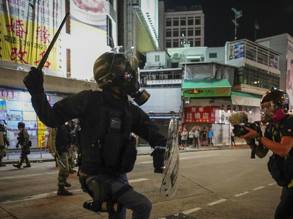 An evening sit-in at a suburban train station on the three-month anniversary ended with a violent attack on protesters by men with suspected organised crime ties. Picture: AP Photo