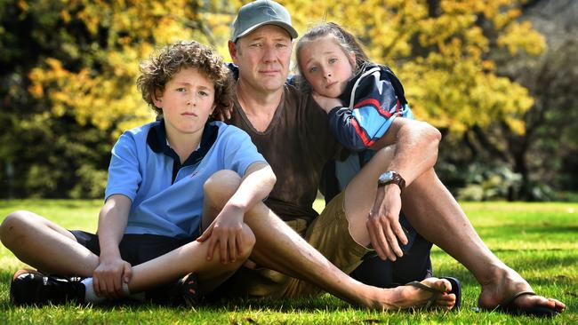 Shane Newton - with children Tom, 14, and Meg, 11 - has lost almost all hearing in one ear after several operations. Picture: Tony Gough