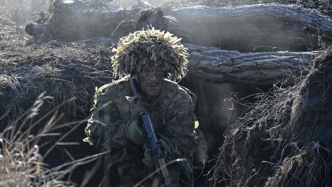 A serviceman of the Alkatraz special rifle battalion of the 93rd Motorized Brigade takes part in a military drill in an undisclosed location in the Donetsk region in February. Picture: Genya Savilov / AFP