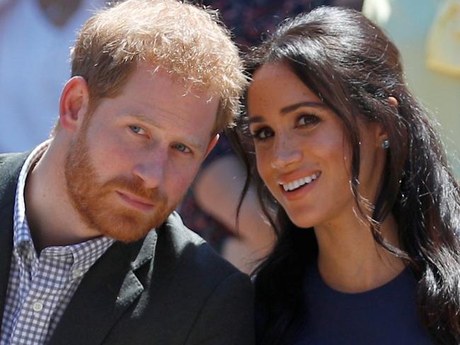 SYDNEY, AUSTRALIA - OCTOBER 19: Prince Harry, Duke of Sussex and Meghan, Duchess of Sussex watch a performance during their visit to Macarthur Girls High School on October 19, 2018 in Sydney, Australia. The Duke and Duchess of Sussex are on their official 16-day Autumn tour visiting cities in Australia, Fiji, Tonga and New Zealand. (Photo by Phil Noble - Pool/Getty Images)