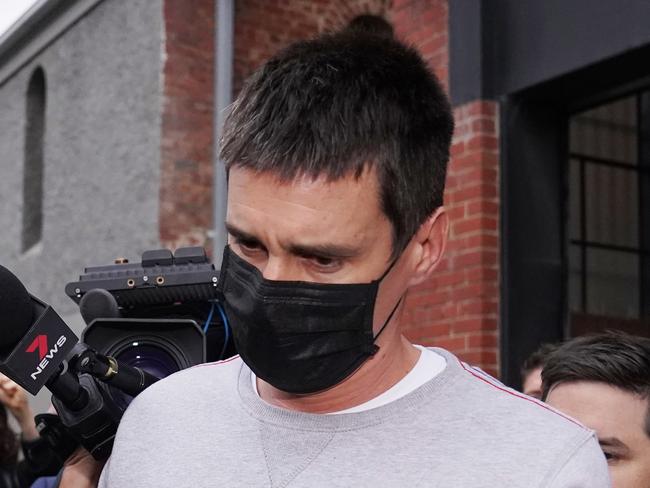 Richard Pusey, the driver of a Porsche who allegedly fled the scene of a truck crash on Melbourne's Eastern Freeway which killed four police officers, is taken away from his Fitzroy property by police in Melbourne, Thursday, April 23, 2020. (AAP Image/Michael Dodge) NO ARCHIVING