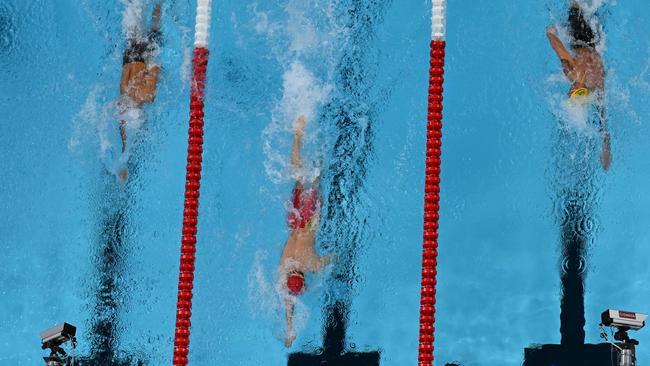 CORRECTION / An overview shows China's Pan Zhanle (C) as he competes to  win the final of the men's 100m freestyle swimming event during the Paris 2024 Olympic Games at the Paris La Defense Arena in Nanterre, west of Paris, on July 31, 2024. (Photo by Manan VATSYAYANA / AFP) / The erroneous mention appearing in the metadata of this photo has been modified in AFP systems in the following manner: [Byline: Manan VATSYAYANA] instead of [Byline: Jonathan NACKSTRAND]. Please immediately correct the erroneous mention on all your online services and servers. If you have been authorized by AFP to distribute it to third parties, please ensure that the same actions are carried out by them. Failure to promptly comply with these instructions will entail liability on your part for any continued or post notification usage. Therefore we thank you very much for all your attention and prompt action. We are sorry for the inconvenience this notification may cause and remain at your disposal for any further information you may require.