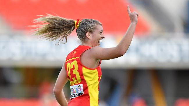 Kalinda Howarth of the Suns celebrates kicking a goal during the Round 3 AFLW match between the Gold Coast Suns and Brisbane Lions at Metricon Stadium on the Gold Coast, Saturday, February 22, 2020 (AAP Image/Darren England)