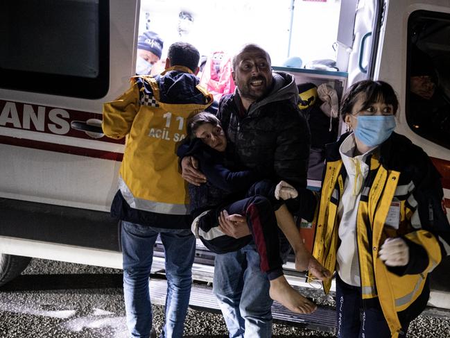 A boy coming out of a building destroyed in the new earthquake in Hatay. Picture: Getty Images