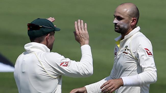 Nathan Lyon celebrates the dismissal of Pakistan's Azhar Ali on his way to a great haul of four wickets in six balls. Picture: AP