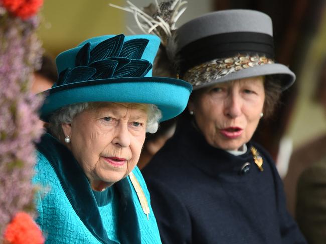 (FILE PIC)  Britain's Queen Elizabeth II and Britain's Princess Anne, Princess Royal, attend the annual Braemar Gathering in Braemar, central Scotland, on September 1, 2018. - The Braemar Gathering is a traditional Scottish Highland Games which predates the 1745 Uprising, and since 1848 it has been regularly attended by the reigning Monarch Queen Elizabeth and members of the Royal Family. (Photo by ANDY BUCHANAN / AFP)