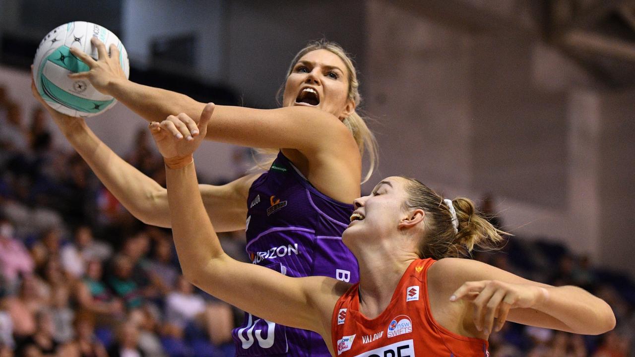 Swifts GK Teigan O’Shannassy goes up against Firebirds Gretel Bueta in action during the match between the NSW Swifts and the Queensland Firebirds on Day 2 of the Super Netball: Team Girls Cup at Parkville Stadium, in Melbourne, Saturday, February 26, 2022. (AAP Image/James Ross) NO ARCHIVING, EDITORIAL USE ONLY