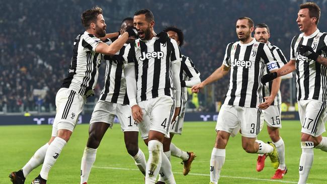 Juventus' Medhi Benatia, second from left, celebrates with teammates